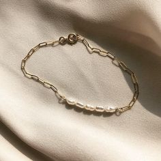 "V I V E Vive is the Latin word for live // 14k gold-filled chain bracelet with either freshwater pearl or turquoise. Perfect on its own or stacked! Both styles have matching necklaces! Check out the ALEXANDRA and UDINA necklaces~ great for gifting. Sized by circumference: Extra Small: 6\" Small: 6.5\" Medium: 7\" Large: 7.5\" Extra Large: 8\" *This bracelet comes with a 0.5\" extender chain which is not included in these measurements. We suggest you measure for this bracelet by wrapping a measu Dainty Beaded Bracelet With Extender For Everyday, Dainty Beaded Bracelet For Everyday, Everyday Jubilee Bracelet, Minimalist Pearl Bracelet With Extender, Dainty Oyster Chain Bracelet For Everyday, Everyday Minimalist Pearl Bracelet With Extender, Minimalist Everyday Pearl Bracelet With Adjustable Chain, Everyday Minimalist Pearl Bracelet With Adjustable Chain, Dainty Hypoallergenic Pearl Bracelet For Everyday