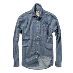 A breathable twill shirt with a denim twist Light Indigo Cotton Tops With Button Closure, Unstructured Indigo Button-up Shirt, Unstructured Button-up Denim Blue Top, Unstructured Denim Blue Button-up Top, Blue Unstructured Washed Tops, Fitted Denim Blue Cotton Shirt, Light Indigo Cotton Shirt For Fall, Unstructured Dark Wash Cotton Shirt, Unstructured Cotton Shirt In Dark Wash