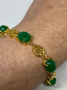 Vintage Green Jade Bracelet Golden white bronze vintage gold finished white bronze Does not tarnish Genuine green jade color enhanced 7.5 inches All jewelry is shipped in a nice gift box. Engraving is $4 per letter and is not always perfect depending on the piece. It can take a few days if the jeweler is busy. This is payable to Paypal Judithsltd@gmail.com Gold Jade Jewelry For Anniversary, Classic Gold Jade Jewelry, Elegant Gold Jade Bracelets, Classic Green Bracelets For Gifts, Yellow Gold Jade Bracelets As Gift, Yellow Gold Jade Bracelets For Gift, Formal Gold Jade Bracelets, Green Costume Jewelry Bracelets For Gifts, Color Verde Jade