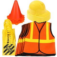 a construction worker's uniform and safety equipment are shown in this image, including an orange traffic cone