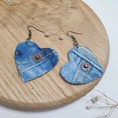 pair of denim heart shaped earrings on wooden board