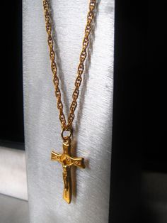 Gold Crucifix Pendant Necklace Modern Crucifix Pendant Gold Spiritual Jewelry Religious Pendant Gift for Her PENDANT St. Benedict Crucifix is Italian made of metal with a 24K gold alloy overlay. It is marked Italy for authenticity and measures .75 x 1.25 inches. It has a nice weight and modern styling. The piece signifies protection from temptation/evil/affliction/disease. CHAIN Necklace is a solid stainless steel, traditional rope chain that is 3mm wide and has rich gold alloy overlay. Closure Gold Cross Jewelry With Adjustable Chain, Gold Plated Crucifix Jewelry With Adjustable Chain, Gold Plated Crucifix Necklace, Gold Crucifix Jewelry Gift, Gift Jewelry Chain With Crucifix Shape, Gold-tone Cross-shaped Gold-plated Jewelry, Gold-tone Cross-shaped Gold Plated Jewelry, Gold-tone Cross Shaped Gold Plated Jewelry, Gold-tone Gold-plated Cross Jewelry