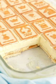 there is a cake that has been cut into squares and put in the pan to be eaten