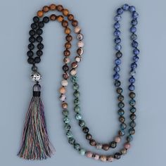 1 pc. Stones: Lava Rock, Phoebe Nanmu Stone, Zebra Stone, African Turquoise, Rhodochrosite, Mosaic Quartz, & Sodalite. Pendant Size: 12cm Pendant Metal: Zinc Alloy Bead Size: 8mm Length: 112cm Natural stone mala necklace unisex yoga meditation long tassels bead necklace Agate Beaded Bracelets With 108 Beads For Meditation, Traditional Mala With Gemstone Beads For Healing, Beaded Mala Amulet For Meditation, Beaded Amulet Mala For Meditation, Adjustable Polished Beads Necklace For Rituals, Adjustable Polished Bead Necklaces For Rituals, Spiritual Healing Mala With Round Beads, Multicolor Spiritual Long Beaded Necklaces, Traditional Mala With Natural Stones For Meditation