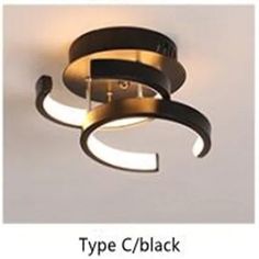 a black and gold light fixture with white lights