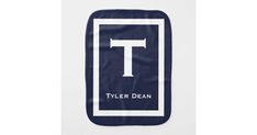 the tyler dean logo on a blue and white bib that says,'t '