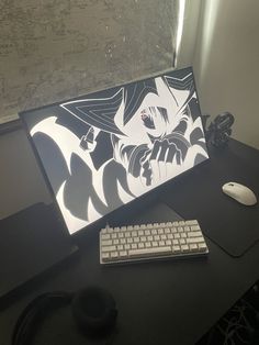 a desktop computer sitting on top of a wooden desk next to a keyboard and mouse