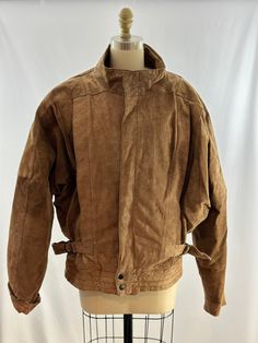 This 80s brown leather is so rad. In a soft leather, zips up the front with a hidden zipper panel, batwing sleeves, paneled leather detailing on the front, a light geo print design, zippers by the back cuffs and adjustable side buckles. Yes, this jacket has it all. -Vintage 80s  -Batwing design -Professional leather clean recommended Measurements:  s,m l depending on the fit you wish to achieve  *Sleeve 15 1/2 inches from seam *Bust 32 inches (batwing style) *Length 25 1/2 inches  *Bottom openin Brown Biker Jacket For Fall Outdoor Activities, Brown Fall Biker Jacket For Outdoor, Brown Biker Jacket For Fall Outdoor, Retro Leather Jacket For Outdoor, Vintage Brown Biker Jacket For Outdoor, Vintage Biker Jacket With Zipper For Outdoor, Vintage Brown Leather Jacket For Outdoor, Brown Biker Jacket With Zipper Closure For Outdoor, Retro Outdoor Leather Jacket