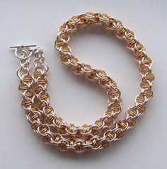 I made this choker using inverted round weave with captive rings.  The rings I made myself using jewellers saw so they close perfectly. The wire has copper base and non-tarnighing coating which will keep this necklace shiny for a long time. I can add extention chain at no extra cost.  I can make this kind of choker from Sterling Silver and/or Gold filled wire (e-mail me for details and price)  Please allow 1 - 2 weeks for making. Metal Chain Necklace For Jewelry Making, Metal Round Chain Necklace For Jewelry Making, Nickel-free Gold Chain Link Jewelry, Handmade Round Metal Chain Necklace, Jump Ring Link Jewelry As Gift, Round Chainmail Metal Jewelry, Jump Ring Chain Link Jewelry For Jewelry Making, Handmade Metal Chain Necklace With Round Pendant, Round Metal Chainmail Jewelry