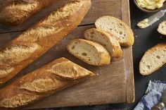 sliced bread on a cutting board with butter