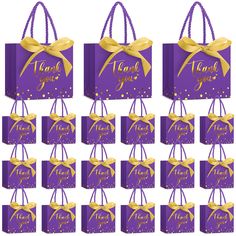 purple gift bags with gold ribbon and name on them