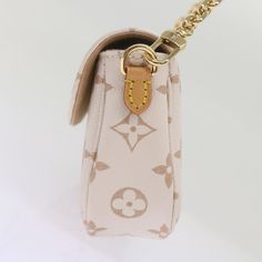 LOUIS VUITTON Monogram Dune Wallet On Chain Ivy Bag Beige M83091 Auth ar11396S   BRAND : LOUIS VUITTON    Color : Beige    Material : Monogram Canvas     Size(cm) : W22cm x H11.5cm x D5cm(Approx)    Size(inch) : W8.7 x H4.5 x D2.0inch(Approx)    Style : Shoulder Bag    Comes with : Dust Bag / Item Box    Serial No. : E0:16:3C:01:F6:CA:AA:5C    Made in : France       This item has been used and may have some minor flaws. Before purchasing, please refer to the images for the exact condition of the item.  We cannot confirm the time period listed.  A return request must be submitted within 48 hours after delivery. Customer is responsible for return shipping costs and fees. Estimated return shipping costs for this item are $80. Contact Our Customer Support for details.  This item ships internat Evening Bags With Gold-tone Hardware And Monogram Canvas, Evening Shoulder Bag In Monogram Canvas, Evening Monogram Canvas Crossbody Shoulder Bag, Beige Monogram Canvas Bag For Evening, Vintage Evening Bags With Adjustable Strap, Vintage Monogram Canvas Gold Bag, Vintage Gold Monogram Canvas Bag, Elegant Monogram Canvas Shoulder Bag With Adjustable Strap, Elegant Monogram Canvas Clutch For Travel