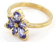 .99ctw pear shape and .12ctw marquise tanzanite 18k yellow gold over sterling silver asymmetrical flower ring. Measures approximately .48"L x .54"W. Not sizeable. 14k Gold Flower Shaped Gemstone Jewelry, Classic Flower Gemstone Jewelry, Classic Flower-shaped Gemstone Jewelry, Fine Jewelry With Flower-shaped Prong Setting, Anniversary Yellow Gold Tanzanite Jewelry, Formal Multi-stone Flower-shaped Jewelry, Fine Jewelry Flower-shaped Gemstone, Fine Jewelry Gemstone Flower Design, Fine Jewelry Flower Gemstone