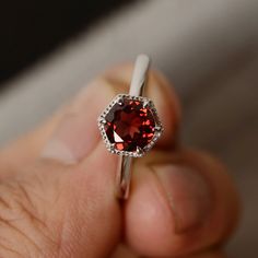 This is a gorgeous handmade creation. Its beauty is its simplicity & Elegance. The 7mm round cut natural garnet is crafted in solid sterling silver and with rhodium plated. All item is sent in a beautiful gift box You can realize more lovely stuff clicking the link https://www.etsy.com/shop/knightjewelry?refshopsection_shophome_leftnav Please leave the correct address and you phone number for delivering successfully. Classic Garnet Solitaire Rings, Classic Solitaire Garnet Ring, Fine Jewelry Garnet Solitaire Ring, Garnet Ruby Ring For Promise, Garnet Solitaire Rings, Classic Garnet Birthstone Ring, Classic Garnet Birthstone Ring With Center Stone, Round Garnet Solitaire Ring, Classic Garnet Round Cut Ring