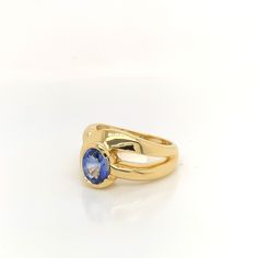 This custom sapphire ring is created in 18K yellow gold. There is a half bezel set royal blue  Ceylon sapphire featured in the ring, weighing 1.58 carat. The stone was weighed loose. The ring itself has a flowing bypass design with a split shank, weighing a total of 12.3 grams. Half Bezel Setting, Half Bezel, Bezel Set Ring, Ceylon Sapphire, Set Ring, Split Shank, Bezel Setting, Sapphire Ring, Royal Blue