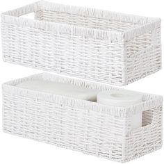 two white wicker storage baskets with lids and handles, one holding toilet paper rolls