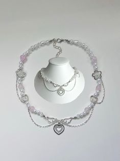 An Angel inspired beaded necklace which incorporates silver chains to excentuate its soft pink feminine design. This necklace was designed and hand crafted by myself with care and very close attention to detail to give off a delicate princess aesthetic. Each one of the beads and charms where carefully placed by me to enhance its coquette touch.  Perfect as a gift to your friend or sister for their birthday (or any occaistion!). Also perfect as a gift for yourself! Your order wil include a clear ziplock storage bag for your necklace and instructions on how to care for your new jewellery.  The default length of this necklace measures to 15' inches with a 2.5' inch extension chain.  If you wish to customize it to your desired length, feel free to add your request in the personalisation tool b Pink Heart Pendant Beaded Necklace For Gift, Pink Beaded Necklace With Heart Pendant As Gift, Pink Heart Pendant Beaded Necklace As Gift, Pink Beaded Chain Jewelry For Valentine's Day, Pink Beaded Heart Pendant Necklace, Dainty Pink Beaded Necklaces With Heart Beads, Dainty Pink Beaded Necklace With Heart Beads, Pink Beaded Necklaces With Silver Beads For Gifts, Pink Beaded Heart Pendant Jewelry