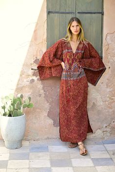 Long bohemian kaftan dress in beautiful fabric and cut. An amazing master piece one of a kind bohemian dress with fancy sleeves and two slits at the side . Made out of 85% silk and 15% viscose. Very soft light and unique fabric. With this dress you will have a ethnic royal look. Only One available ! Will fit size S - L. Traditional V-neck Maxi Dress With Boho Print, Traditional V-neck Maxi Dress For Beach Cover-up, Red Maxi Dress For Beach Cover-up, Bohemian Flowy Tunic Maxi Dress, Boho Print Tunic Maxi Dress For Beach, Bohemian Floor-length Dresses For Festivals, Flowy Bohemian Tunic Maxi Dress, Brown V-neck Maxi Dress For Festival, Bohemian Kaftan With Kimono Sleeves For Beach