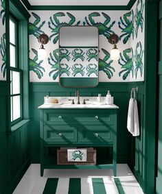 a bathroom with green and white walls and flooring