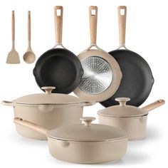 an assortment of pots and pans with wooden handles