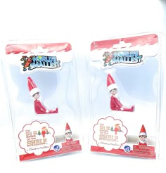 two red and white elf magnets in plastic packaging