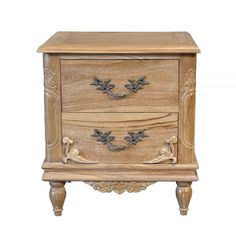 a wooden cabinet with two drawers on one side and an ornate design on the other