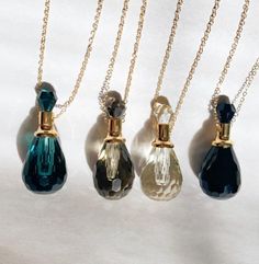 || Welcome to Oil Design Co. ||Here you will find everything from Marbled Roller Bottles, Gold Foiled Spray Bottles, Diffuser Jewelry, Vial Necklaces and Digital Roller Labels. If you have any questions please contact us as we are happy to help.Each crystal vial necklace makes for the perfect gift for your favorite essential oil lover or yourself. With four different color options Citrine, Black Quartz, Smokey Quartz, and Aqua Obsidian. Fits 4-5 drops of your favorite essential oil. Chain is adj Gift Perfume, Essential Oil Necklace, Perfume Necklace, Essential Oil Necklaces, Vial Necklace, Glass Bottle Diy, Essential Oils Gifts, Wardrobe Wishlist, Oil Gifts