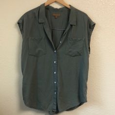 Army Green Sleeveless Button Up Shirt. Nwot In Excellent Condition. Jachs Girlfriend Size Large Casual Sleeveless Blouse For Work, Casual Sleeveless Shirt For Work, Sleeveless Tops With Snap Buttons For Work, Casual Sleeveless Everyday Blouse, Casual Sleeveless Blouse For Everyday, Everyday Sleeveless Tops With Buttons, Sleeveless Tops With Pockets For Everyday, Sleeveless Tops With Buttons For Everyday, Casual Sleeveless Shirt With Button Closure