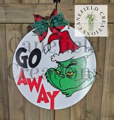 For all those Grinch Lovers!! Perfect addition to any front door!  This hanger is available in 18" or 22" round and is made with 1/4" wood. It also has 3d pieces including the wording, the decorative pieces, sealed. Comes with looped hanger to hang sign. IMPORTANT INFORMATION: All of are signs are made from Birch. Our signs are made from real wood, which means you may see wood knots, crevices and other imperfections. This is what adds character to every piece and makes every sign unique! Also, s Grinch Door Sign, Grinch Signs, Grinch Sign, Block Head, Door Signs Diy, Wreath Hanger, Christmas Door Hanger, Round Art, Dog Signs