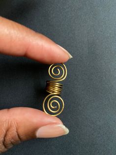 Traditional loc jewelry finished with an untraditional spiral! Bohemian Gold Spiral Wrap Earrings, Spiral Brass Wire Wrapped Jewelry, Spiral Wire Wrapped Brass Jewelry, Adjustable Spiral Nickel-free Jewelry, Unique Swirl Metal Jewelry, Bohemian Spiral Hand Wrapped Jewelry, Unique Swirl Shaped Metal Jewelry, Bohemian Gold Swirl Jewelry, Unique Adjustable Spiral Wrap Earrings