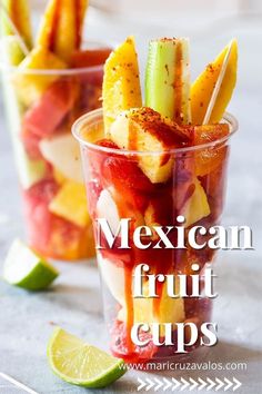 mexican fruit cups with strawberries, celery, and limes in them