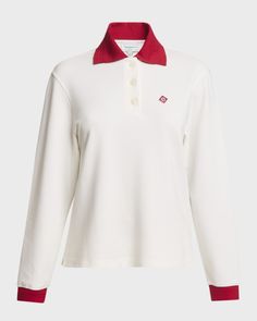 CASABLANCA polo shirt features a logo patch at the front     Spread collar; button closure     Long sleeves; ribbed cuffs     Midlength     Relaxed fit     Pullover style     Viscose/nylon/polyamide/elastane    Dry clean    Made in Portugal Fitted Polo Collar Top With Button Cuffs, White Polo Sweater With Ribbed Cuffs For Work, Classic White Polo Shirt With Contrast Collar, White Polo Shirt With Striped Collar For Workwear, White Polo Sweater With Striped Collar For Fall, Sporty Polo Shirt With Ribbed Collar For Work, Sporty Striped Collar Top For Workwear, Work Polo Shirt With Button Cuffs, White Seamless Collar Polo Shirt For Work