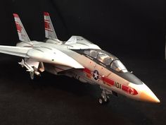 a model fighter jet sitting on top of a table