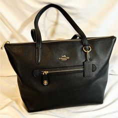 New W/Tags Coach Taylor Tote Pebble Leather Retail $275 Inside Zip, Cell Phone And Multifunction Pockets Zip-Top Closure, Fabric Lining Handles With 9 1/2" Drop Outside Zip Pocket 11 1/2" (L) X 10 1/4" (H) 5 1/2" (W) Style No. F38312 Branded Hardware Pebbled Leather Tote Bag, Pebbled Leather Bags With Zipper Closure For Work, Elegant Pebbled Leather Shoulder Bag For Shopping, Elegant Pebbled Leather Shopping Bags, Chic Bags With Branded Hardware And Pebbled Leather, Elegant Bags With Pebbled Leather And Leather Handles, Pebbled Leather Tote Shoulder Bag With Zipper Closure, Pebbled Leather Tote Shoulder Bag With Zipper, Luxury Coach Pebbled Leather Shoulder Bag