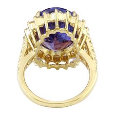 Elegant Gold Tanzanite Diamond Ring, Yellow Gold Tanzanite Diamond Ring With Accent Stones, Yellow Gold Diamond Ring With Tanzanite In Prong Setting, Yellow Gold Tanzanite Rings With Brilliant Cut, Luxury Tanzanite Yellow Gold Ring, Yellow Gold Tanzanite Rings With Accent Stones, Gold Tanzanite Diamond Ring Fine Jewelry, Luxury Yellow Gold Tanzanite Ring, Gold Tanzanite Gemstone Rings