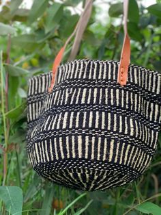 Summer handbags, Christmas Gift ,Summer handbags, Christmas GiftKiondo overview A of Sisal and wool with leather handles. Made of thick sisal fiber for firmness, beauty and durability. A Blue and Red shopping handbag made of sisal  and wool with leather handles. The bag is made of sisal fiber that is hand picked hand prepared into yearn then twisted and weaved together with recycked wool . It is finished with natural leather mainly from cow hide. Uses The bag is extra large in size that can acco Artisan Tote Bag For Shopping, Black Bucket Straw Bag, Eco-friendly Black Woven Shoulder Bag, Handwoven Top Handle Bucket Bag For Shopping, Handwoven Bucket Tote Bag For Daily Use, Black Leather Handle Bucket Bag, Eco-friendly Bucket Shape Shoulder Bag For Shopping, Handwoven Tote Bucket Bag, Black Bucket Bag With Leather Handles For Market