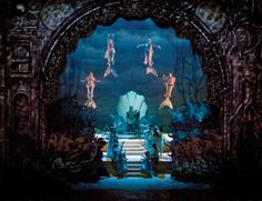 an elaborate stage set with mermaids on it