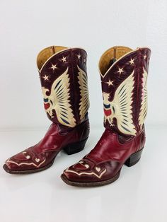 Vintage Eagle & Hearts Cowboy Boots killer custom eagle & hearts inlay design! squared off toe stack wood heel 2 tone red leather with white to off set design huge eagle at front & back stars trim with white piping trim hearts at toe front & back heel by bronco great vintage condition, minor surface wear appx size - 7  10.5 toe-heel 12 tall 3.75 wide 1.5 heel All sales are final Fun Cowboy Boots, Vintage Hand Tooled Boots With Round Toe, Vintage Hand-tooled Boots With Round Toe, Vintage Hand-tooled Boots For Western-themed Events, Vintage Red Boots With Leather Sole, Fitted Red Vintage Boots, Painted Cowboy Boots, Cowgirl Things, Custom Cowboy Boots