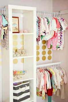 the closet is full of baby's clothes and other things to wear in it