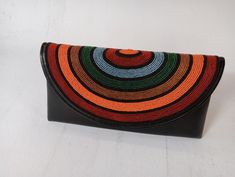 African purses, bags,African print bag, women purses ,gift for her,beaded purse, valentine gift for her 100% handmade using soft leather and fine beads Very beautiful and unique Very stylish Perfect for weddings, parties and African themed events We ship via DHL express For wholesale please contact us Handmade Black Evening Bag For Gift, Beaded Rectangular Clutch For Gift, Beaded Rectangular Clutch As Gift, Rectangular Beaded Clutch As Gift, Multicolor Pouch Evening Bag For Gift, Multicolor Pouch Evening Bag As Gift, Multicolor Handmade Evening Bag For Everyday Use, Handmade Multicolor Rectangular Evening Bag, Multicolor Clutch Bag For Gift