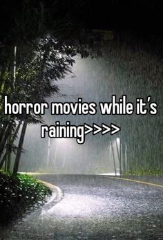 the words horror movies while it's raining are in front of a dark road