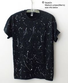 NEW hand painted white paint splatters on a Black T-shirt that are inspired by shooting stars.  The manufacture of the original Tee shirt is Gildan, 100% Cotton.    MEDIUM -Adult Unisex(Men's): Width is approx. 20 inches, Length is approx. 29 inches, Sleeve Center Back is approx. 17 inches MoreTee Shirts: https://www.etsy.com/shop/Styleon THIS NEW T-SHIRT HAS BEEN WASHED after it's painted and is ready to wear!  Washing instructions: Turn inside out and wash on cold or cool water gentle cycle, t Paint Splatter Shirt, Lightning Shirt, Painted Shirt, White Streetwear, Paint Shirts, Reverse Tie Dye, Tie Dye Shirt, White Paint, Shooting Stars