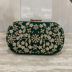 Introducing our designer Handmade clutches. With detailed intricate work, these purses are perfect for a daily wear as well as party wear. Comes with a detachable chain, you can easily switch from a hand purse to a crossbody. Spacious enough to fit daily essential needs as well as all kind of Phones. This gorgeous clutch in emerald green with detailed tiny pearl and embroidery work is such an elegant piece. ALL SALES ARE FINAL. KINDLY MESSAGE ME FOR ANY INQUIRIES. Hand Purse, Wedding Bags, Handmade Clutch, Purse For Women, Accessories Bags Purses, Wedding Bag, Embroidery Work, Handbag Purse, Crossbody Purse