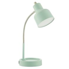 the light green desk lamp has an adjustable arm and is on top of a white base