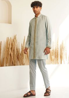 Featuring a Powder Blue Chinese Collar Silk Kurta Set, designed with a sleek Chinese collar, hidden placket, and hand-embroidered details for a touch of elegance. Paired with matching pants, this ensemble is perfect for an engagement, Roka, or sangeet, combining sophisticated style with traditional charm. Composition : Chanderi Silk Care: Dry Clean Only and Vacuum Storage This product can be customized for sleeves, length and colour Delivery : 4-6 weeks as the product is hand crafted. Check Size Guide or choose MySize for free customisation (All Sizes above XL can be made at 15% additional cost) For more information and sizes please contact fabiliciousfashion@gmail.com or visit our Copenhagen studio. About the Designer : Shreyansh, a distinguished designer label specializing in luxurious e Silk Kurta Set, Chinese Collar, Vacuum Storage, Indian Wedding Wear, Silk Kurta, Designer Label, Embroidered Details, Matching Pants, Kurta Set