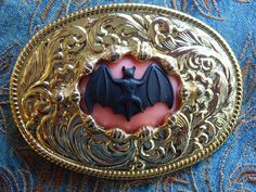 We are a small independent company based in Derbyshire. We source our materials worldwide to create something a little different and unique Our high quality  belt buckles are made from Strong metal  into which we have set a resin bat centre 30mm x 40mm. Buckle gold coloured metal  size of buckle 9.5cm x 7cm will fit up to a 40mm wide belt We will refund you £5 if you purchase one of our leather belts and a buckle together Gerard Way Bat Belt Buckle, Spider Belt Buckle, Black Metal Pin Buckle Belt, Fantasy Belt Buckle, Bat Belt Buckle, Black Vampire, Goth Halloween, Collar Tips, Vampire Bat