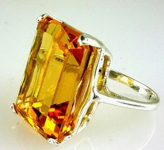 ALL OUR JEWELRY IS HANDCRAFTED IN THE U.S.A. This fine quality richly colored Bolivian Citrine with a wonderful golden -yellow hue set in a bold, traditional design. This is a comfortable solitaire ring made of solid 925 sterling silver. This is a great everyday ring that you'll wear everywhere, from the grocery to date night. makes a perfect gift. Citrine is the Birthstone for November. (1) Citrine, Emerald Cut, 16X12 MM - 10.54 Carats If you need your item for a special occasion we will try to Orange Polished Finish Wedding Jewelry, Orange Polished Wedding Jewelry, Yellow Octagon Wedding Ring, Formal Yellow Rectangular Rings, Orange Emerald Cut Jewelry For Anniversary, Formal Yellow Octagon Ring, Formal Orange Rectangular Jewelry, Yellow Rectangular Stone Jewelry For Formal Occasions, Orange Rings With 17 Jewels For Gift