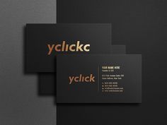 three black and gold business cards with the word yclickc on them, sitting next to each other