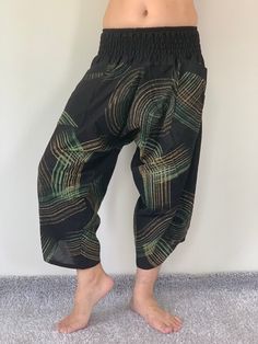 "Samurai Pants, elastic waist Samurai Pants Unisex Elastic Waist, ninja pants Samurai Pants (Unisex) Elastic Waist MATERIAL: 100% Cotton APPROX MEASUREMENT: Elastic Waist :24\"- 40\" Length :34\" Hip up to :52\" Around Ankle: 18 inch Pockets: x 2 Material : Cotton ♥ PAYMENT We accept payments via PayPal only. ♥ Shipping : - All items will be shipped within 1 business day after received payment. We ship items via DHL Express. ♥ Delivery Time : USA only 2 business days Canada: 2- 3 business days F Traditional Black Wide Leg Bottoms, Black Relaxed Fit Pants For Festival, Black Harem Pants With Elastic Waistband For Festivals, Traditional Black Pants With Pockets, Baggy Black Pants For Festival, Black Baggy Pants For Festival, Traditional Black Harem Pants With Elastic Waistband, Ninja Pants, Yoga Harem Pants