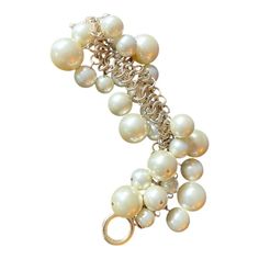 Fun and fab Kenneth Lane bracelet with large Champagne toned faux pearls attached to a pale gold link bracelet. Toggle clasp. Not adjustable — best fits a petite wrist. Circa 1980s. Cream Bracelet Jewelry For Party, Cream Colored Bracelet For Formal Occasions, Cream Bracelet For Formal Occasions, Cream Colored Formal Bracelet Jewelry, Cream Formal Bracelet Jewelry, Elegant Cream Metal Jewelry, Elegant Metal Charm Bracelet With Extender, Elegant Charm Bracelet For Jewelry Making, Elegant Charm Bracelet With Lobster Clasp For Wedding